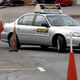 This Jan. 24, 2007 file photo shows a student going through parking cones at a driving school course in Tucker, Ga. Image credit: Gene Blythe/AP